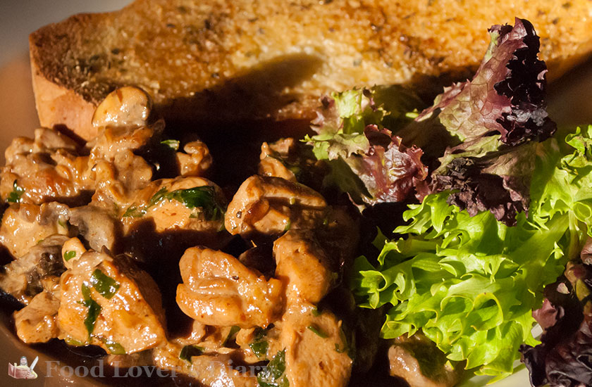 Serve the chicken with garlic bread and green salad