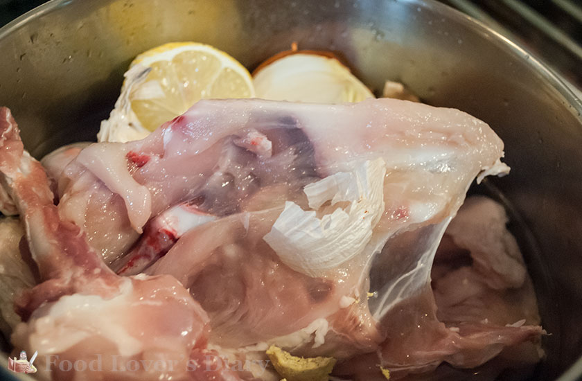 The bones put in a pot with onion and lemon to make stock